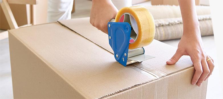 Customer using 2 inch-wide clear packaging tape to reinforce box seams.